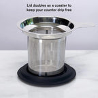 Stainless tea infuser resting on silicone lid