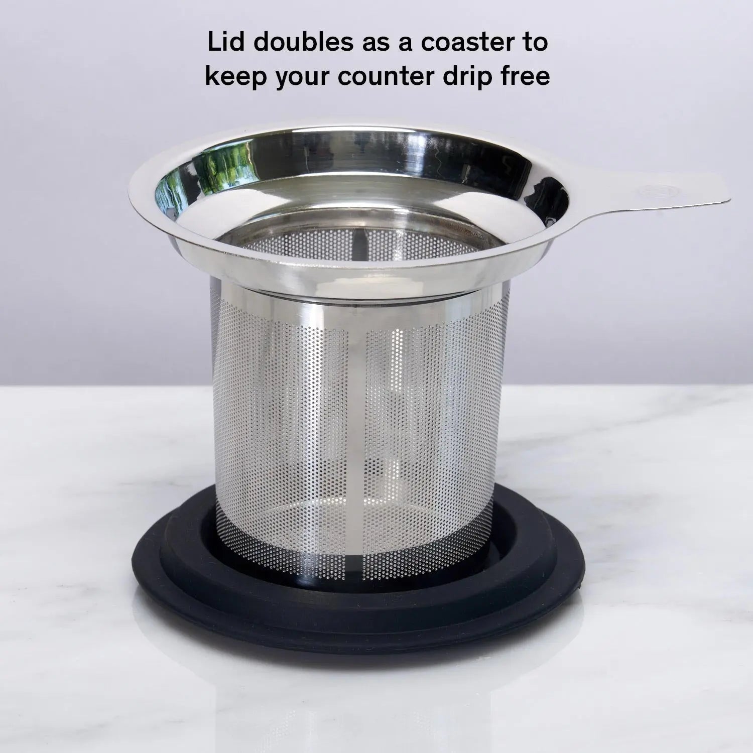 Stainless tea infuser resting on silicone lid