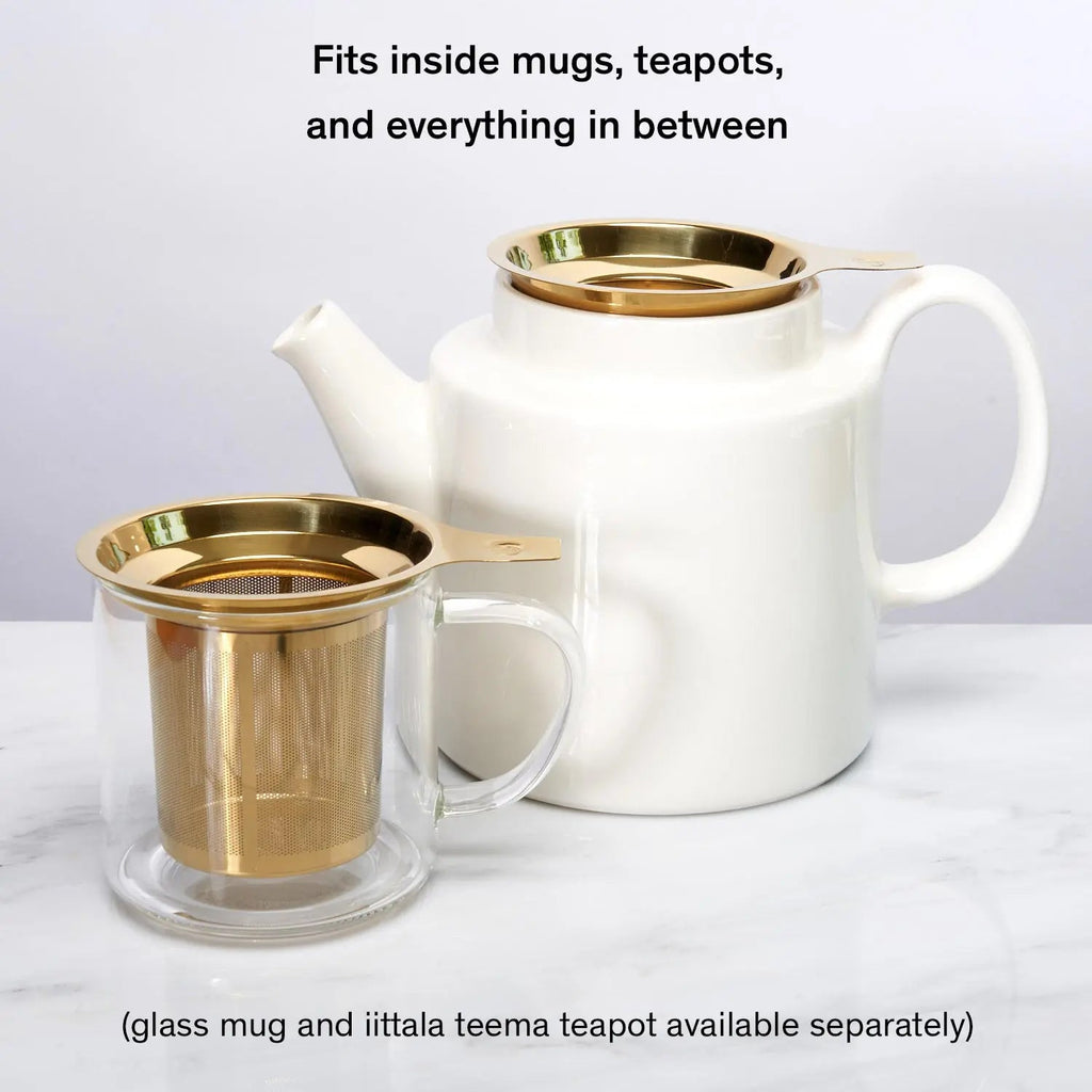 Gold tea infuser with teapot and mug