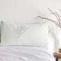 Adjustable bamboo cooling pillow on a bed