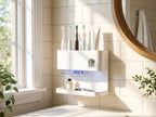 Close-up detail view of the wall-mounted toothbrush organizer and dispenser with UV feature